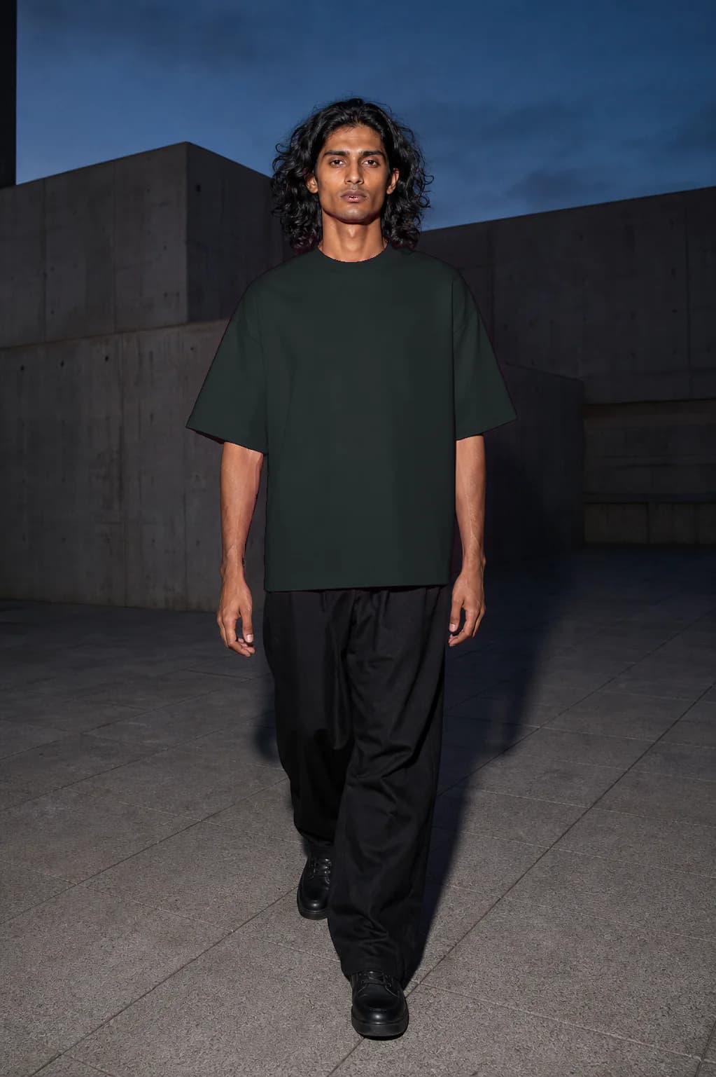 Abyss heavyweight T-shirt, walking fit on a South Asian adult model, personalized with number —